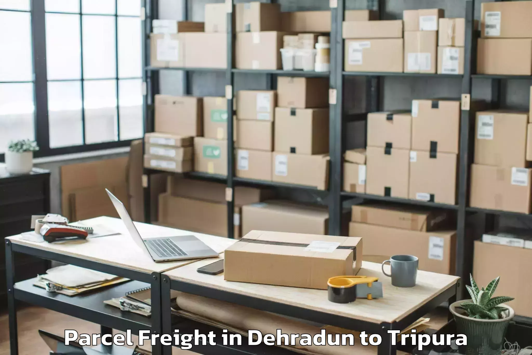 Book Your Dehradun to Kamalpur Airport Ixq Parcel Freight Today